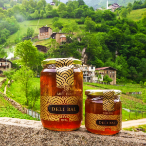 Multiple jars of Turkish Deli Mal Mad Honey with Turkey landscape