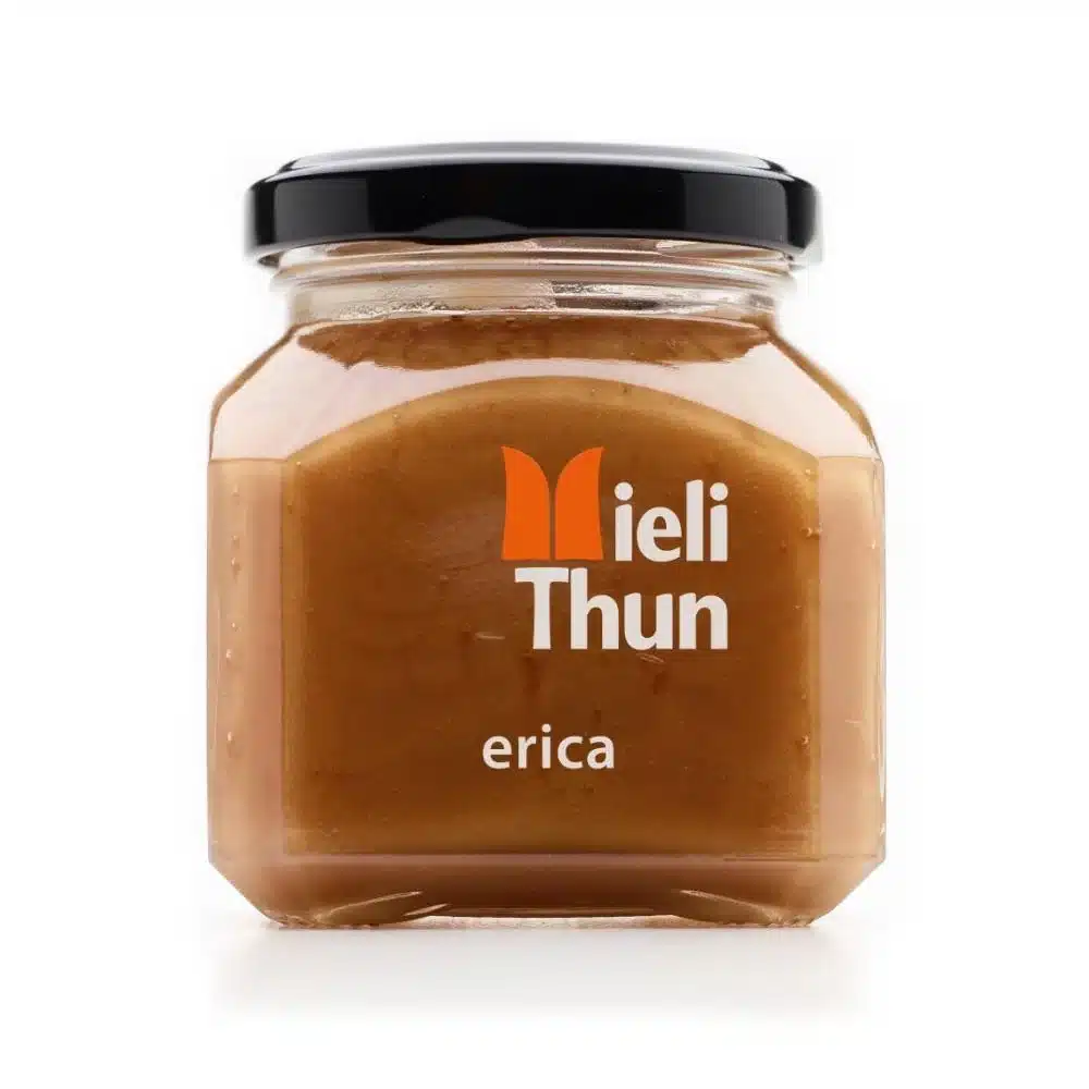 Jar of Meili Thun Erica Heather Honey with a black lid and amber honey visible through the glass.