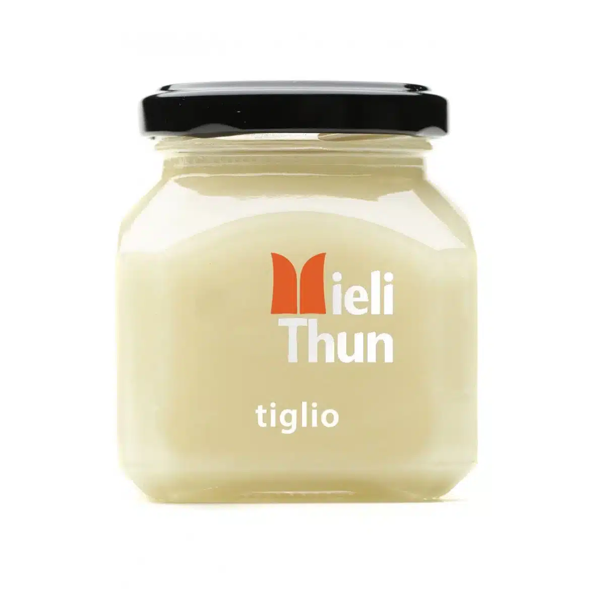 Jar of pale Meili Thun Linden Honey labeled “tiglio,” with a black lid, on a white background.